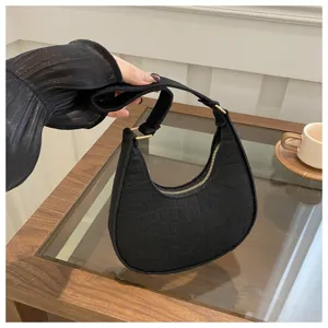 Stylish black crocodile pattern underarm bag detail shot, chic single shoulder hobo handbag