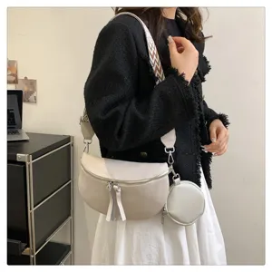 Women stylish saddle crossbody bag with wide strap and coin purse, beige chic shoulder bag.