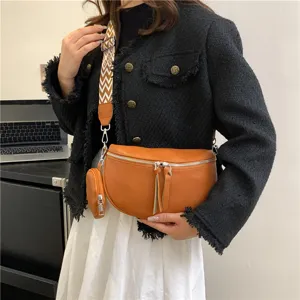 Stylish women brown saddle bag trendy crossbody shoulder chest bag with wide strap.