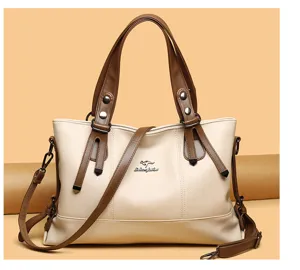 Large capacity soft leather women handbag with double shoulder straps and metal logo decor.