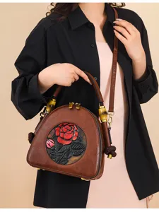 Vintage geprägte Leder-Umhängetasche mit Blumenrelief und Bambusgriff für Damen Pendeln.