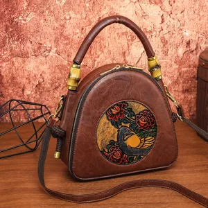 Vintage braune geprägte Umhängetasche mit Retro-Vogel und Rosen-Blumenmuster für Damen.