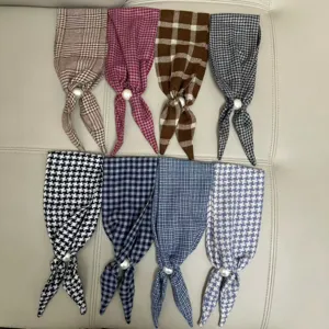 Stylish plaid and houndstooth neck scarves featuring chic pearl magnetic clasps for easy styling.