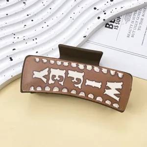 Western style leather hair claw clip for women, vintage brown shark clip with pattern.