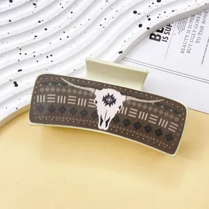 Western cowboy style leather hair claw clip with vintage bull skull print for women trendy.
