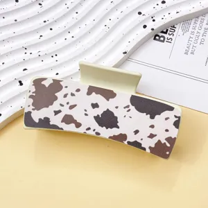 Stylish cow print hair claw clip, chic leather shark clip for women's daily hair styling.