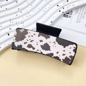 Stylish cow print hair claw clip for women, western cowboy style shark clip for daily hair styling.