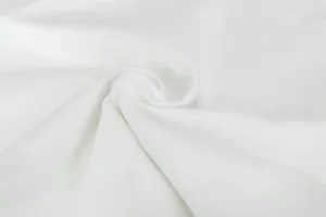 White canvas fabric texture close up detail shot showing soft material and weaving quality.