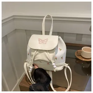 Zaino piccolo in pelle PU bianca con ricamo di farfalla rosa e stampa floreale per uso quotidiano.