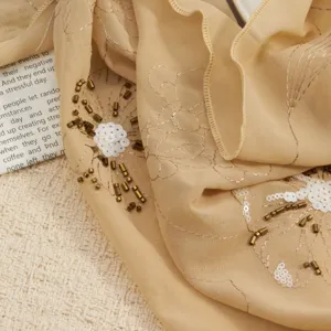 Detailed view of the vintage embroidered beaded sequin floral chiffon headscarf fabric.