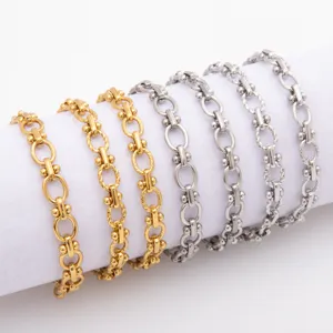 Detail view of titanium steel dumbbell link chains in gold and silver, featuring unique style.