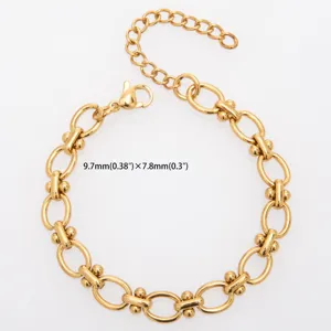 Detail view of golden stainless steel dumbbell link chain jewelry component, smooth polished surface.