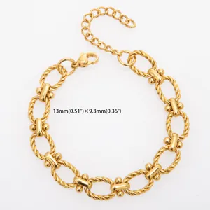 Detailed view of the gold-tone titanium steel twisted link bracelet with dual ball connectors.