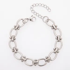 Stainless steel dumbbell link chain detail shot, high quality metal jewelry accessory.