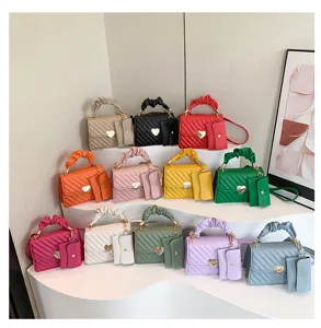 Trendy women crossbody bag featuring ruffled handle, heart clasp and cute attached mini pouch.