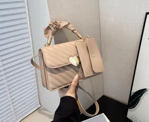 Korean style quilted crossbody bag for women with heart lock and mini pouch detail