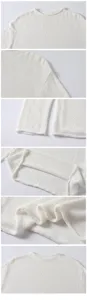 Detail view of a white loose knit pullover top, showcasing fine linen cotton texture, cuffs and neckline.