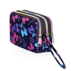 Detailed view of the multi-zipper canvas wallet featuring cute rabbit and bow prints with wrist strap.