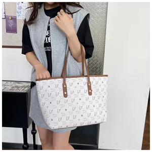 Large capacity white swan pattern tote bag with brown leather handles and chic design.