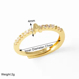 Close-up detail view of gold-plated letter A ring with sparkling cubic zirconia pavé stones.