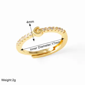 Gold plated letter G ring with cubic zirconia detail, inner diameter 17mm, 4mm width style.