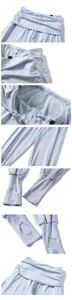 Light blue yoga fitness pants detail view featuring high stacked waist and stirrup design.
