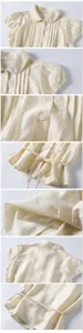 Close-up details of Korean style short sleeve blouse featuring Peter Pan collar and lace.