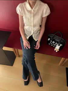 Korean style short sleeve blouse with Peter Pan collar and satin texture for women.