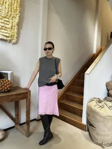 Pink french casual linen blend fishtail midi skirt with elegant drape, detail view.