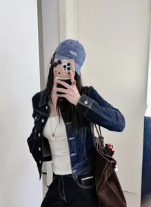 Classic dark denim jacket for women, vintage slim fit raw denim outerwear with stylish buttons.
