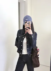 Women's dark denim jacket slim fit vintage retro style casual everyday outerwear coat chic top.
