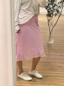 Pink tencel linen bias cut skirt detail, featuring smooth drape and elegant flow for daily wear.