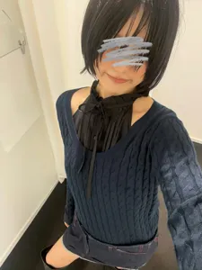 Dark blue cable knit sweater with black ruffled collar blouse and stylish denim skirt outfit.