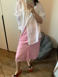 Elegant pink linen blend bias cut fishtail midi skirt paired with a classic white long shirt.