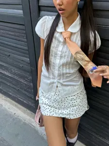 Korean style baby doll short sleeve blouse with peter pan collar and cute tie detail.