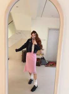 Pink asymmetric mermaid midi skirt detail shot, elegant drape and stylish daily wear look.