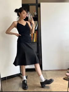 Slim black mermaid midi skirt for women, casual elegant high waist flared hem skirt.