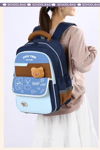 Kids contrast color school backpack with front pocket and cute bear doll for students.