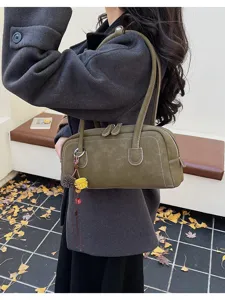 Retro olive green shoulder pillow bag for women, stylish autumn winter commuting handbag.