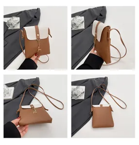 Mini crossbody phone bag with cute deer pendant, stylish brown and white design for women.