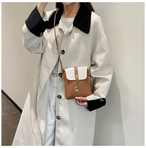 Detailed view of the stylish mini crossbody phone bag worn by model, perfect for daily use.
