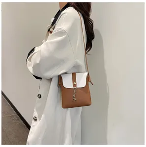Stylish contrast color mini crossbody bag for women, featuring a cute deer pendant detail.