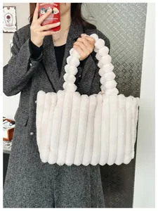 Fluffy plush tote bag with vertical stripe design and bubble handle for winter.