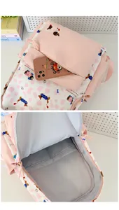 Pink student school backpack detail view showing interior compartment and cute dog print.