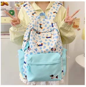 Cute blue dot dachshund print school backpack for teen girls daily casual student use.