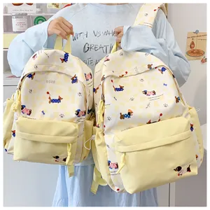 Cute ins style girls canvas school backpack in light yellow with dog print, perfect for daily use.