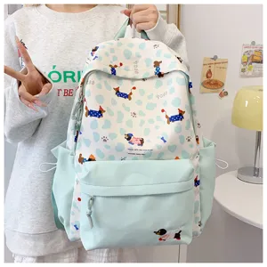 Cute aesthetic student backpack with lovely dachshund print, light blue and white design for school.