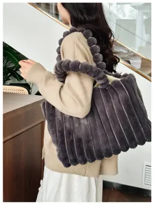 Fluffy plush tote bag for women, stylish dark grey shoulder bag with cute pom-pom handle details.