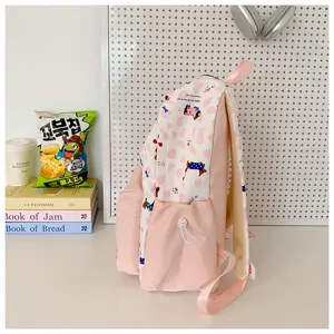 Pink and white cute dog pattern school backpack for teen girls casual daypack bag.