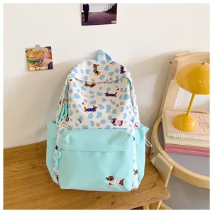 Detail view of the cute blue and white dachshund print school backpack for daily student use.